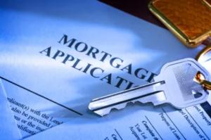 House key resting on a mortgage application form