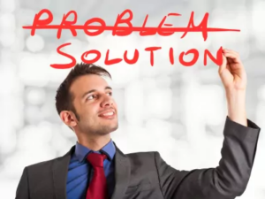 Man crossing out the word problem and writing solution